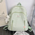 cheap College Backpacks-Women’s Light Green Textured School Backpack with Cute Teddy Bear Keychain, Large Capacity Lightweight Bookbag for Teen Girls, College, and Casual Daily Use
