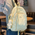 cheap College Backpacks-Women’s Light Green Textured School Backpack with Cute Teddy Bear Keychain, Large Capacity Lightweight Bookbag for Teen Girls, College, and Casual Daily Use