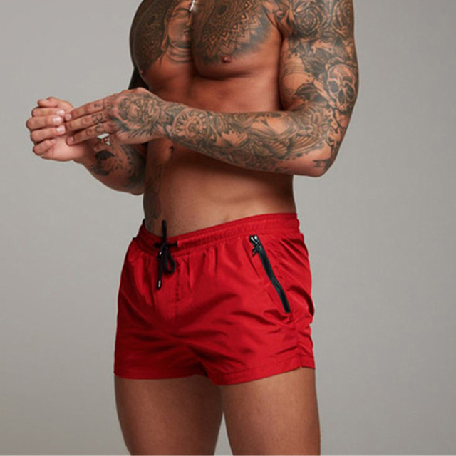  Per uomo Boxer da mare Pantaloncini da mare Asciugatura rapida Leggero Boxer da surf Costume da bagno Fodera in rete Con tasche A cordoncino Nuoto Surf Spiaggia Sport acquatici Tinta unita Estate