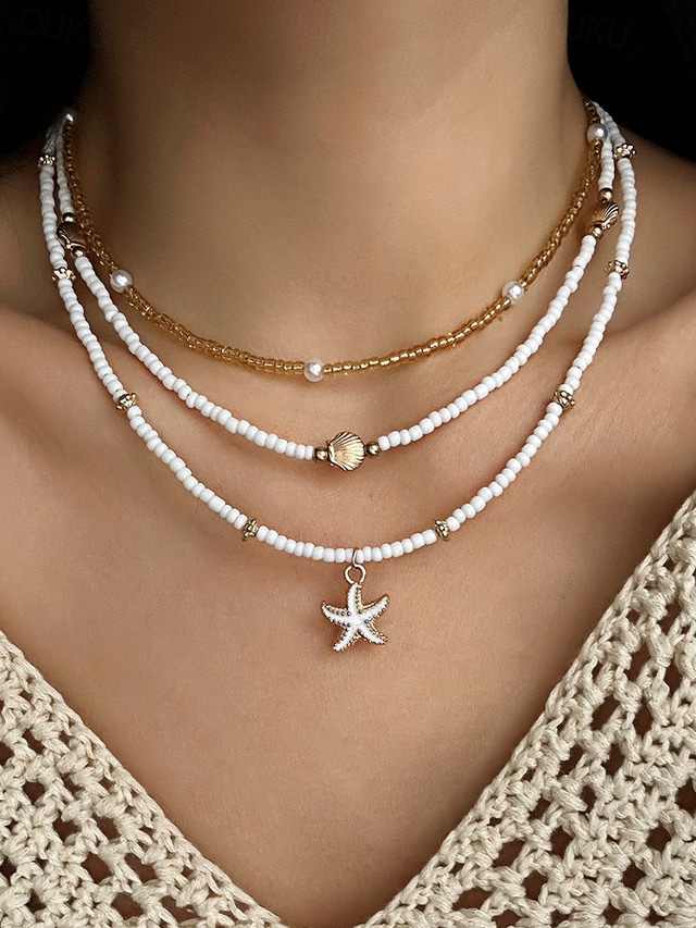  Conjunto de collar y pulsera tobillera en capas estilo playa para mujer con dijes de estrellas de mar y conchas, diseño de cuentas doradas y blancas, adecuado para vacaciones de verano, estilo casual y bohemio.