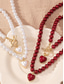abordables Collar de mujer-Conjunto de collar y pulsera de perlas rojas para mujer con colgante de corazón, diseño de cierre en tono dorado, joyería elegante para regalo de San Valentín, bodas y ocasiones especiales.