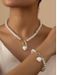 abordables Collar de mujer-Conjunto de collar y pulsera de perlas rojas para mujer con colgante de corazón, diseño de cierre en tono dorado, joyería elegante para regalo de San Valentín, bodas y ocasiones especiales.