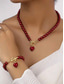 abordables Collar de mujer-Conjunto de collar y pulsera de perlas rojas para mujer con colgante de corazón, diseño de cierre en tono dorado, joyería elegante para regalo de San Valentín, bodas y ocasiones especiales.