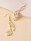 abordables Pendiente de mujer-Pendientes de nota musical de oro con detalles de diamantes de imitación: elegantes joyas colgantes para mujeres, perfectas para conciertos, fiestas y ocasiones especiales.
