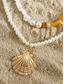 abordables Collar de mujer-Conjunto de collar bohemio de conchas y cuentas en capas para mujer: colgante turquesa estilo playa y dijes dorados para vacaciones de verano y festivales.