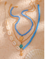 abordables Collar de mujer-Conjunto de collar bohemio de conchas y cuentas en capas para mujer: colgante turquesa estilo playa y dijes dorados para vacaciones de verano y festivales.