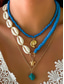 abordables Collar de mujer-Conjunto de collar bohemio de conchas y cuentas en capas para mujer: colgante turquesa estilo playa y dijes dorados para vacaciones de verano y festivales.