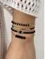 economico Bracciale da donna-Set di braccialetti da donna in stile bohémien con perline nere, decorazioni in oro, gioielli regolabili, alla moda e di tendenza, adatti per l'uso quotidiano, per i viaggi e per le feste