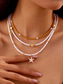 abordables Collar de mujer-Conjunto de collar y pulsera tobillera en capas estilo playa para mujer con dijes de estrellas de mar y conchas, diseño de cuentas doradas y blancas, adecuado para vacaciones de verano, estilo casual y bohemio.