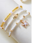 abordables Collar de mujer-Conjunto de collar y pulsera tobillera en capas estilo playa para mujer con dijes de estrellas de mar y conchas, diseño de cuentas doradas y blancas, adecuado para vacaciones de verano, estilo casual y bohemio.