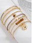 tanie Bransoletka damska-zestaw damskich bransoletek z koralikami w stylu boho – wielorzędowe bransoletki w kolorze złotym i brązowym z akcentami w kształcie serduszek i zawieszek, modna biżuteria na imprezy, festiwale i na co dzień